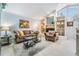 Cozy living room with a fireplace and built-in shelving at 16214 W Course Dr, Tampa, FL 33624