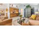 Comfortable living room with view into the kitchen and bar seating at 16214 W Course Dr, Tampa, FL 33624