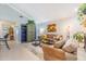Relaxing living room with tile flooring and stylish decor at 16214 W Course Dr, Tampa, FL 33624