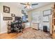 Home office featuring natural light from the window, hardwood floors, and neutral decor at 16214 W Course Dr, Tampa, FL 33624