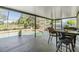Screened in pool with outdoor seating area and a view of the backyard at 16214 W Course Dr, Tampa, FL 33624