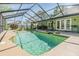 Inviting screened-in pool with spacious seating, perfect for outdoor relaxation and entertaining at 16214 W Course Dr, Tampa, FL 33624