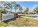 Sign for Northdale Golf & Tennis Club with lush landscaping and parking area at 16214 W Course Dr, Tampa, FL 33624