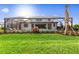 Expansive backyard with a screened pool and lush lawn, perfect for outdoor living and entertaining at 16411 Sapphire Point Dr, Lakewood Ranch, FL 34211