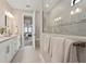 Elegant bathroom with a luxurious walk-in shower and a glimpse of the main bedroom at 16411 Sapphire Point Dr, Lakewood Ranch, FL 34211