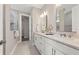 Modern bathroom featuring double sinks, ample counter space, and a separate glass-enclosed shower at 16411 Sapphire Point Dr, Lakewood Ranch, FL 34211