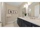 Modern bathroom with double sinks, decorative mirrors, and elegant fixtures, providing a luxurious feel at 16411 Sapphire Point Dr, Lakewood Ranch, FL 34211