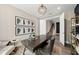 Stylish office with dark wood desk, unique shelving, and neutral walls at 16411 Sapphire Point Dr, Lakewood Ranch, FL 34211