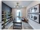 Bright office features modern decor, stylish shelves, and natural light at 16411 Sapphire Point Dr, Lakewood Ranch, FL 34211