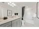 Stylish bathroom with a white bathtub, elegant vanity, and contemporary decor, enhancing the space at 16415 Sapphire Point Dr, Lakewood Ranch, FL 34211
