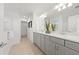 Bright bathroom featuring double vanity with modern fixtures and generous counter space at 16415 Sapphire Point Dr, Lakewood Ranch, FL 34211