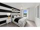 Charming bedroom with modern black and white accents and natural lighting at 16415 Sapphire Point Dr, Lakewood Ranch, FL 34211