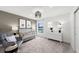 Stylish Bedroom featuring neutral colors, a comfortable chair, and modern décor at 16415 Sapphire Point Dr, Lakewood Ranch, FL 34211