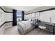Nicely designed bedroom with ample space, neutral paint, modern furnishings, and water view at 16415 Sapphire Point Dr, Lakewood Ranch, FL 34211
