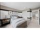 Nicely designed bedroom with ample space, neutral paint, modern furnishings, and ensuite access at 16415 Sapphire Point Dr, Lakewood Ranch, FL 34211