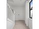 Bright entryway with staircase, white trim, and natural light from nearby window at 16415 Sapphire Point Dr, Lakewood Ranch, FL 34211