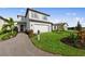 Charming two-story home with lush landscaping and a paved driveway at 16415 Sapphire Point Dr, Lakewood Ranch, FL 34211