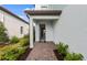 Inviting front entrance with a paved walkway and landscaped garden at 16415 Sapphire Point Dr, Lakewood Ranch, FL 34211