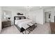 Bright main bedroom featuring a decorative chandelier, neutral colors, and ensuite access at 16415 Sapphire Point Dr, Lakewood Ranch, FL 34211