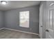 Comfortable bedroom with natural lighting, tiled flooring, and closet at 1708 E Genesee St, Tampa, FL 33610