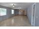 Open floor plan with neutral walls, tiled flooring and natural light make this a desirable living space at 1708 E Genesee St, Tampa, FL 33610