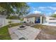 Spacious backyard with a brick patio, perfect for outdoor entertaining and relaxation at 18520 Ambly Ln, Tampa, FL 33647