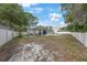 Expansive backyard with a patio and pool, offering ample space for outdoor activities and enjoyment at 18520 Ambly Ln, Tampa, FL 33647
