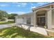 View of the front entrance, featuring a garage and landscaped yard with a nice walkway at 18520 Ambly Ln, Tampa, FL 33647