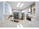Modern kitchen with stainless steel appliances, granite countertops, and ample natural light offers style and function at 18520 Ambly Ln, Tampa, FL 33647