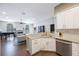 Spacious kitchen with stainless steel appliances, granite countertops, and seamless flow to the living area at 18520 Ambly Ln, Tampa, FL 33647