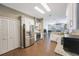 Well-lit kitchen boasts modern appliances, white cabinetry, seamless flow to living space, ideal for entertaining at 18520 Ambly Ln, Tampa, FL 33647