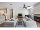 Elegant living room with two sofas, fireplace, and hardwood floors, perfect for entertaining and comfortable living at 18520 Ambly Ln, Tampa, FL 33647