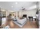 Spacious living room features wood floors, neutral colors, fireplace, and seamless flow to the kitchen at 18520 Ambly Ln, Tampa, FL 33647