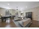 Bright living room with sofas, piano, fireplace and backyard access offers elegant comfort and inviting space at 18520 Ambly Ln, Tampa, FL 33647
