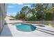 Inviting pool and spa surrounded by a well-kept white fence, perfect for relaxation and outdoor enjoyment at 18520 Ambly Ln, Tampa, FL 33647