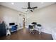 Study with wood floors, neutral colored walls, a ceiling fan and lots of natural light at 18520 Ambly Ln, Tampa, FL 33647