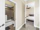 Well-lit bathroom with a shower-tub combination, complemented by a bedroom view at 2101 N Pointe Alexis Dr, Tarpon Springs, FL 34689