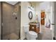 Elegant bathroom featuring a glass-enclosed shower and custom vanity with granite countertop at 2101 N Pointe Alexis Dr, Tarpon Springs, FL 34689