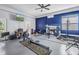 Spacious home gym equipped with modern exercise equipment and a large television at 2101 N Pointe Alexis Dr, Tarpon Springs, FL 34689