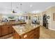 Gourmet kitchen with a large island, stainless steel appliances, granite countertops, and an open layout at 2101 N Pointe Alexis Dr, Tarpon Springs, FL 34689