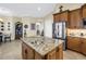 Gourmet kitchen boasts a center island, stainless steel appliances, and beautiful cabinetry at 2101 N Pointe Alexis Dr, Tarpon Springs, FL 34689