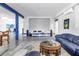 Open concept living room featuring a home theater setup, perfect for movie nights at 2101 N Pointe Alexis Dr, Tarpon Springs, FL 34689