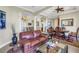 Spacious living room with high ceilings, decorative columns, and an open floor plan at 2101 N Pointe Alexis Dr, Tarpon Springs, FL 34689