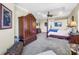 Bright and spacious main bedroom with decorative ceiling, furniture, and a comfortable sitting area at 2101 N Pointe Alexis Dr, Tarpon Springs, FL 34689