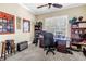 Home office featuring a large desk, bookshelves, and a comfortable workspace at 2101 N Pointe Alexis Dr, Tarpon Springs, FL 34689