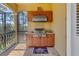 Outdoor kitchen has stainless steel grill and beautiful custom cabinetry at 2101 N Pointe Alexis Dr, Tarpon Springs, FL 34689
