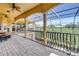 Enjoy breathtaking views from this spacious, screened-in patio with brick flooring at 2101 N Pointe Alexis Dr, Tarpon Springs, FL 34689