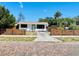 Beautiful exterior view showcasing the lovely yard and unique fencing at 212 41St S St, St Petersburg, FL 33711