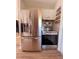 Stainless steel fridge and oven in modern kitchen design at 212 41St S St, St Petersburg, FL 33711