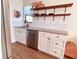 Updated kitchen showcasing granite countertops, white cabinets, and open shelving at 212 41St S St, St Petersburg, FL 33711